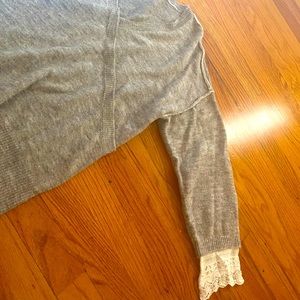 Wrap sweater with lace details on sleeves